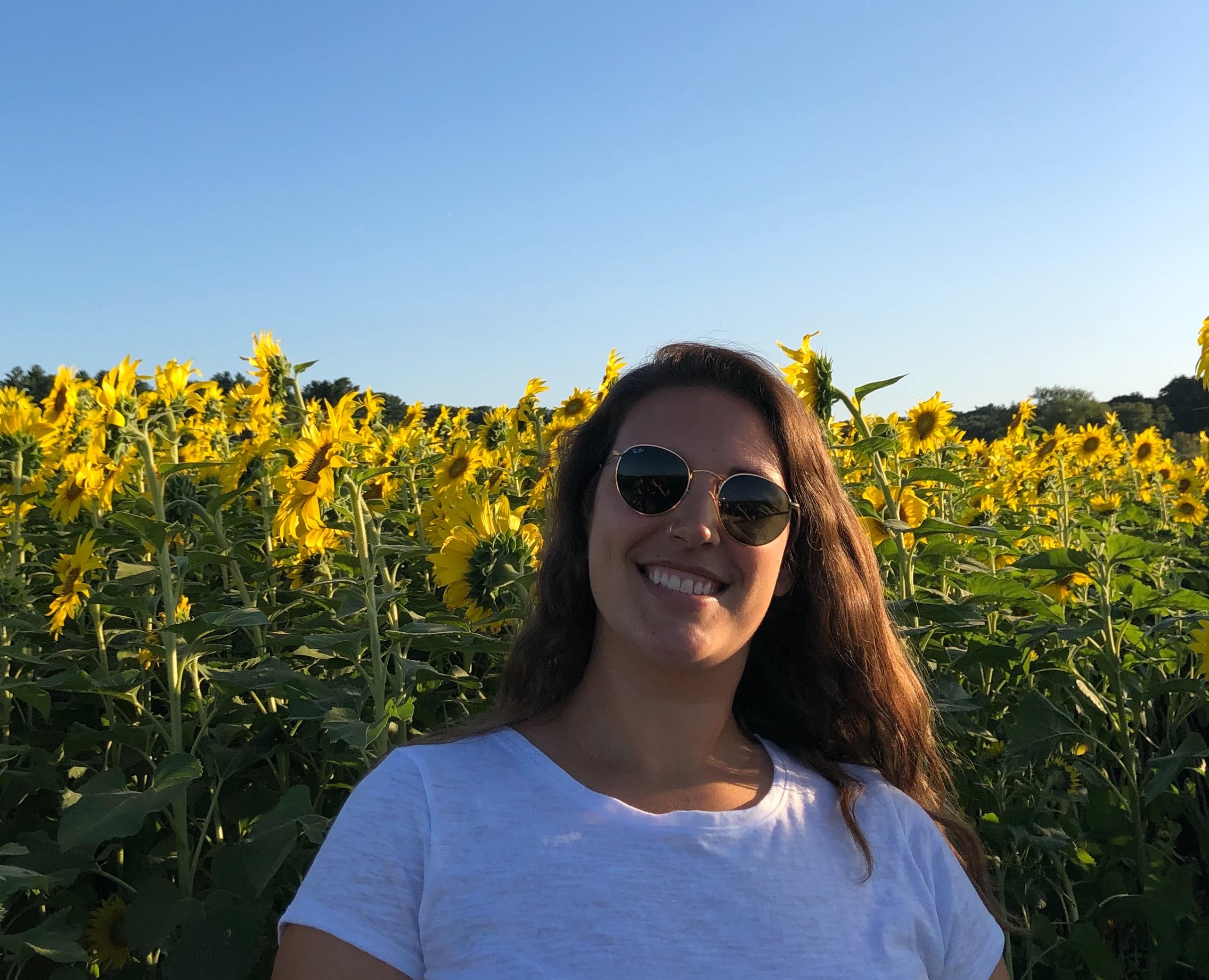 picture of me smiling in a field of sunflowers