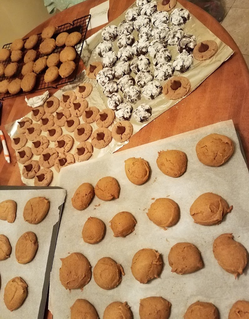 five trays of cookies on a table